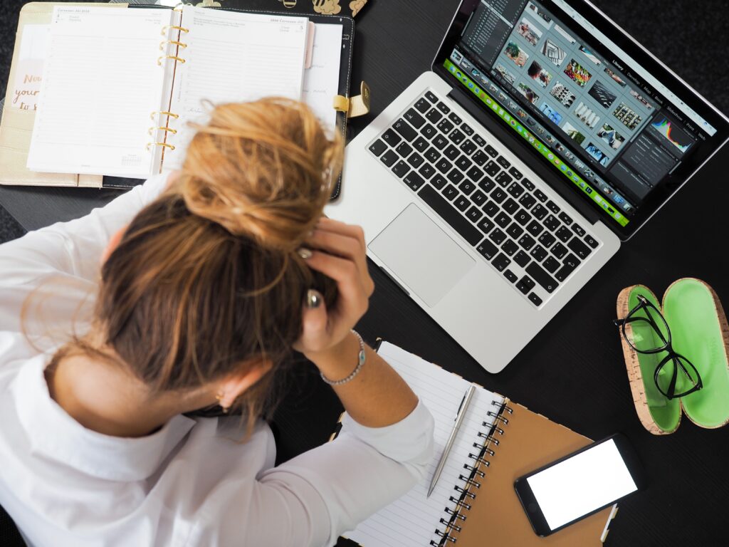 massage therapist overwhelmed by computer work